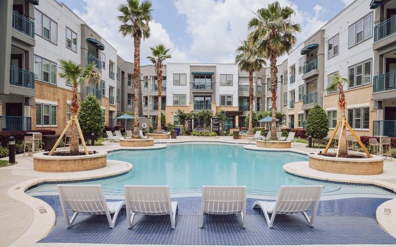 a pool with chairs around it