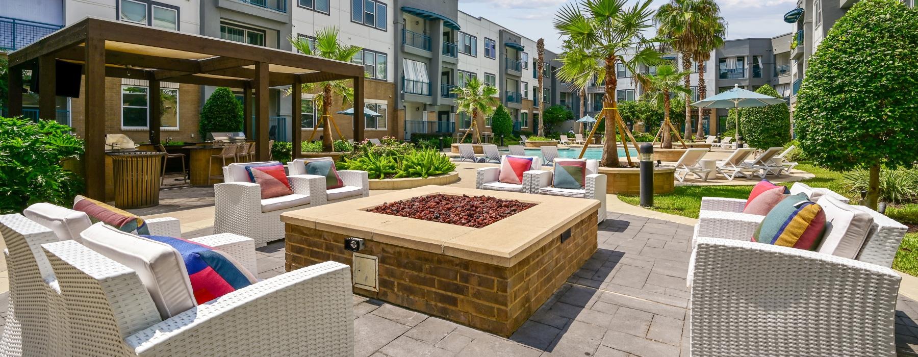 a patio with chairs and a table