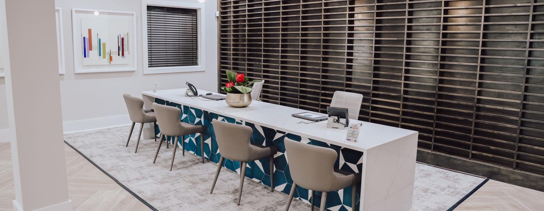 a dining room with a table and chairs