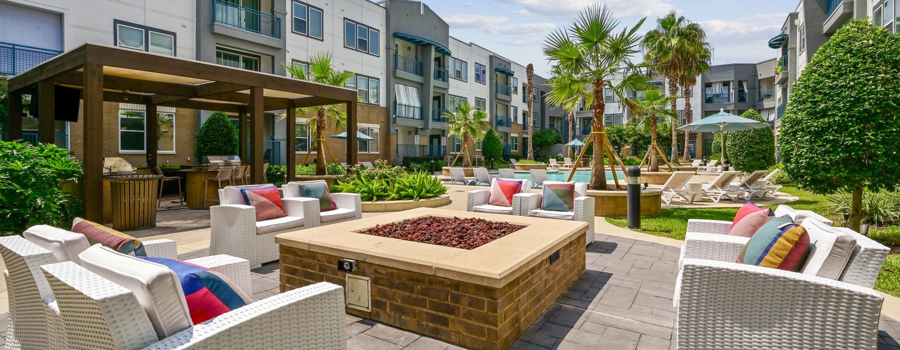 a patio with chairs and a table